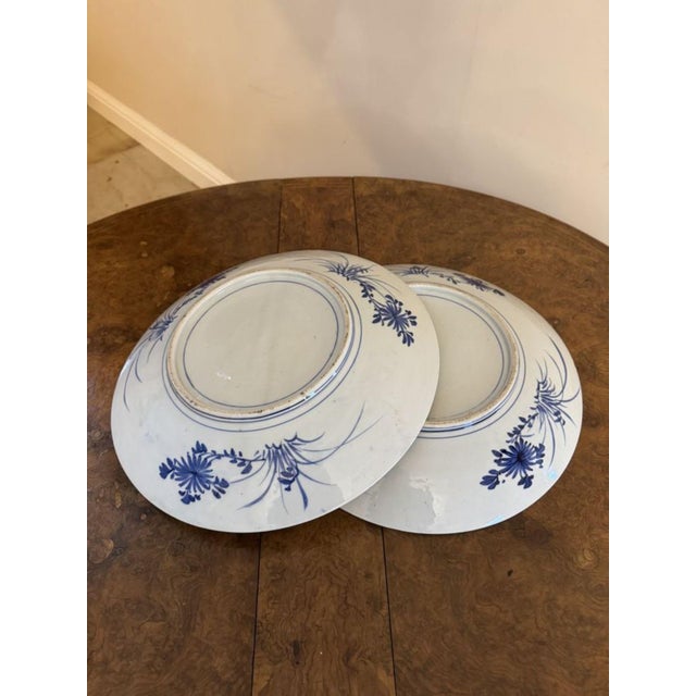 Stunning quality pair of antique Japanese imari blue and white chargers, having a quality pair of antique Japanese imari...