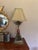 This listing is for a heavy, large table lamp. It features a coral red, hand-painted porcelain detail with brass...
