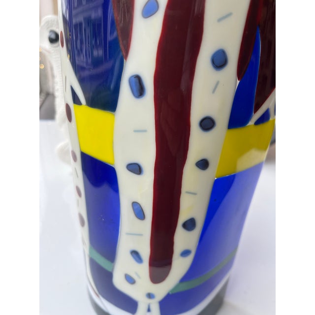 1980s studio art glass sculpture with great color. Tabletop size around end slap with charming scene of art deco ladies.