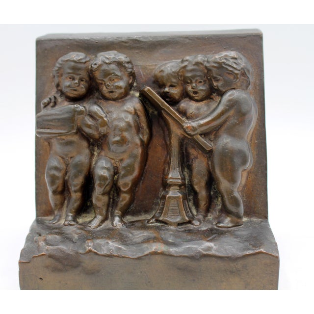 American Circa 1900 Pair of Bronze Plated Bookends Featuring Reliefs of Putti For Sale - Image 3 of 8