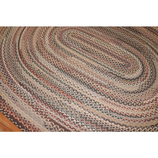 An American Braided room-size carpet from the third quarter of the 20th century in rustic tones. Measures: 8'7'' x 11'2''...