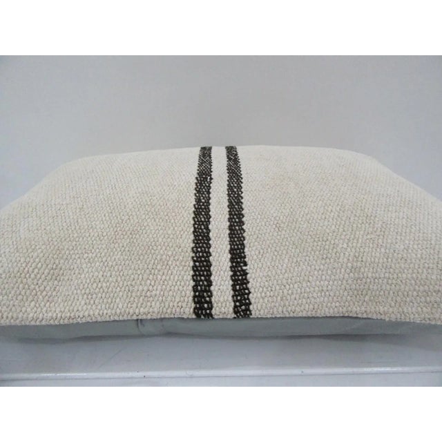 This is a pillow cover made from a vintage kilim rug. The piece was properly washed and ready to use. Pillow inserts not...