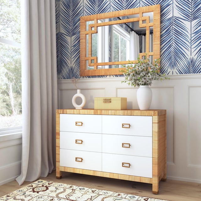 Introducing the Hana Rattan Rectangular Wall Mirror, where coastal charm meets modern design. Wrapped in beautifully...