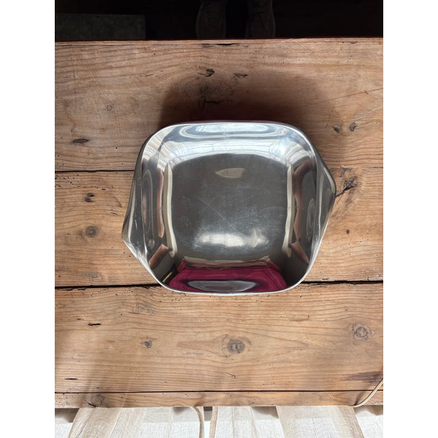 Vintage Nambe #515 serving bowl featuring a fluid, asymmetrical form with softly curved sides and distinctive sculptural...