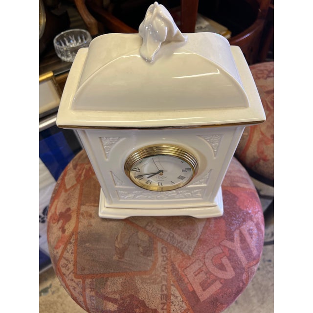 This is a Lenox Timely Traditions Four Seasons Mantel Clock. The piece features Lenox's signature fine ivory china body,...