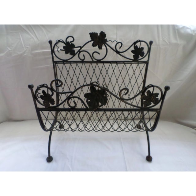 Here is a Ornate Beauty! this Metal Magazine Rack has a metal mesh Basket with a lovely Leaf Design and a Fancy scroll...