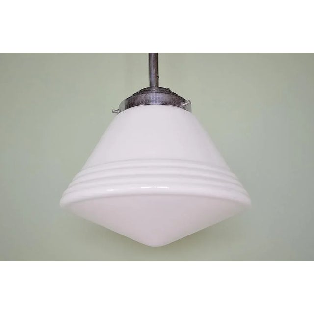 Opal glass ceiling lamp from the Art Deco Bauhaus era. The ceiling lamp has a tapping, tiered opal glass lampshade - the...