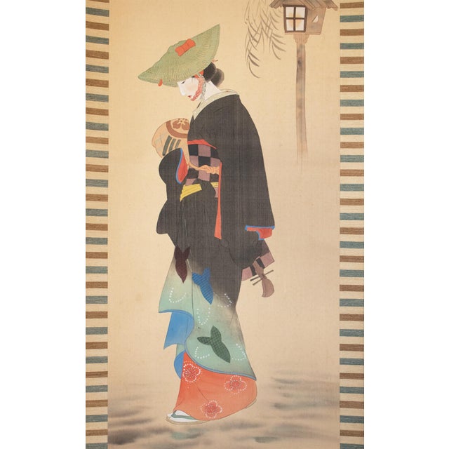 Stunning antique Japanese Yukio-e Style silk scroll painting depicts a beautiful young woman wearing traditional Japanese...