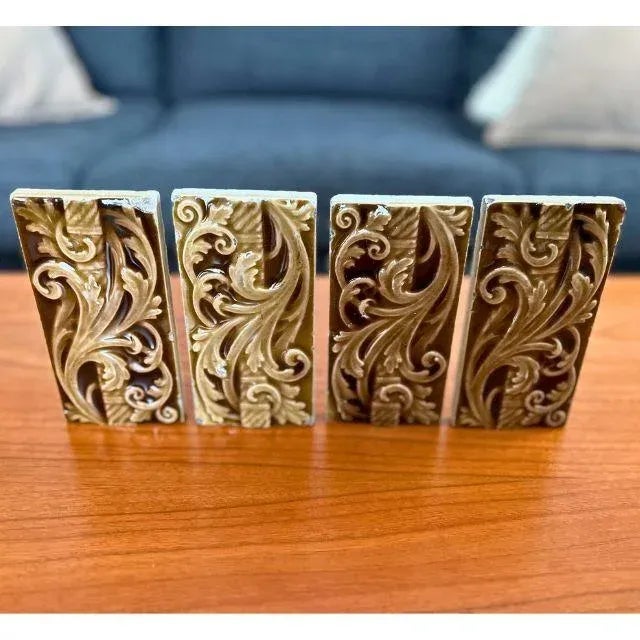 A set of four (4) exquisite high-relief Victorian motif ceramic tiles made by Trent Tile in Trent, New Jersey in the late...