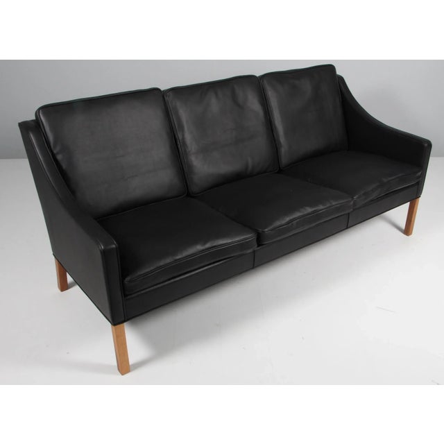 Børge Mogensen three-seat sofa new upholstery with black elegance aniline leather. Legs of teak. Model 2209, made by...