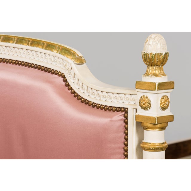 A charming pair of mid-20th century French Louis XVI style twin bed frames sourced from Provence, France. Crafted in...