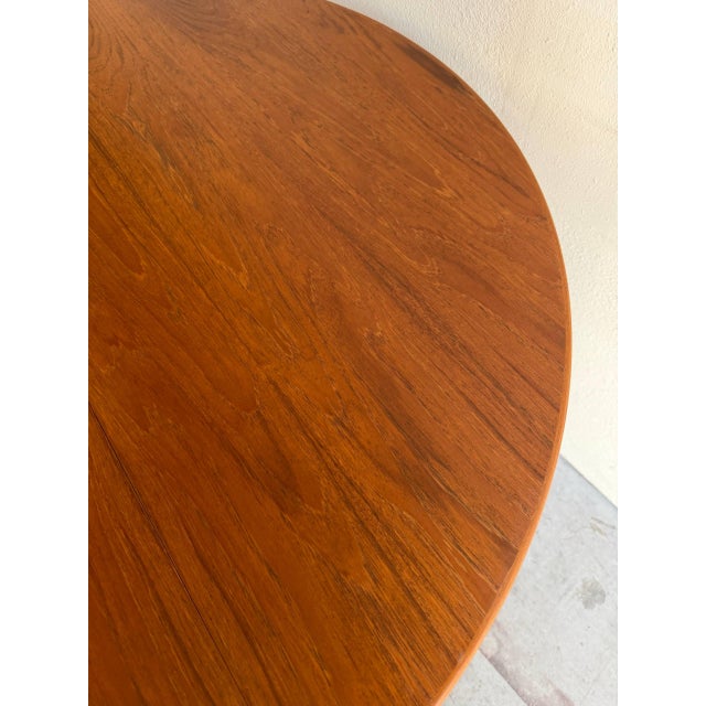 Authentic vintage Danish round dining table crafted in warm teak by Skovmand & Andersen, as confirmed by the original...