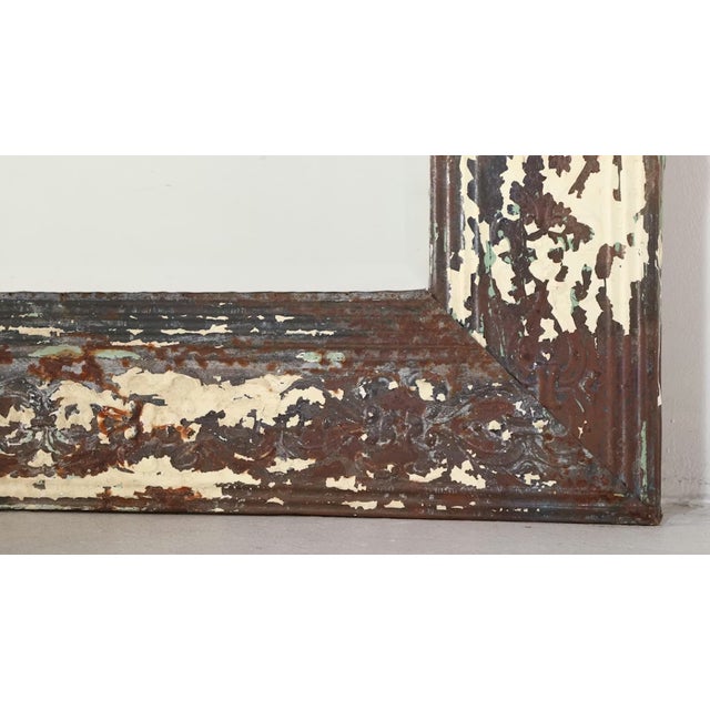 Make a bold statement with this monumental rustic mirror measuring an impressive 72" x 96". Framed in salvaged embossed...