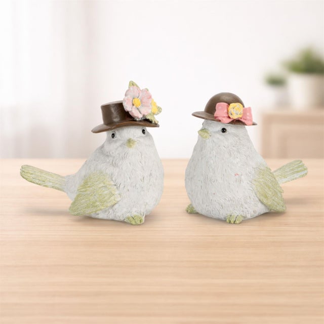 Add a playful and whimsical touch to your decor with this charming bird figure set, featuring soft neutral tones accented...