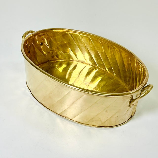 There is nothing more lovely than a vibrant green plant in a brass planter. It adds a touch of sophistication to any room...