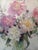 This floral piece is by Ruth Baderian (American, 1927-2010), a well-known impressionist artist recognized for her vibrant...