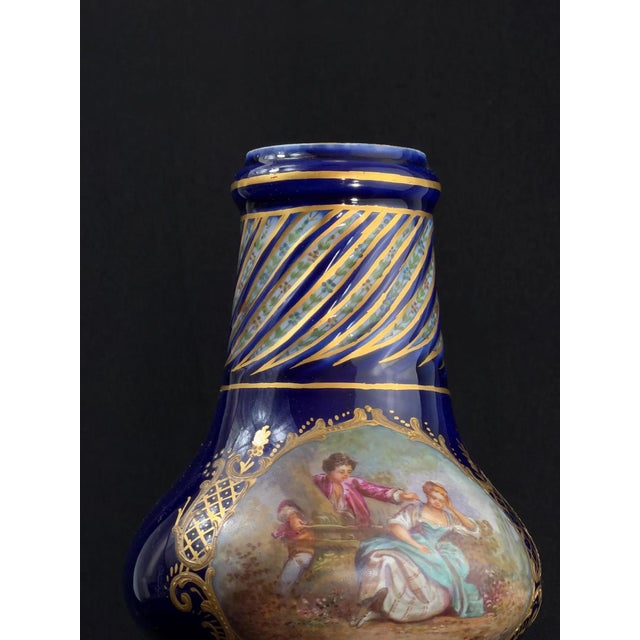Elegant French porcelain vase in the Sèvres style, dating from the Belle Époque period, circa 1890–1910. The piece is...