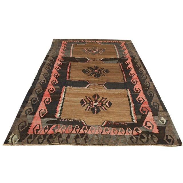 Decorative handwoven vintage kilim rug from Kars region of Turkey. Approximately 50-60 years old. In very good condition.