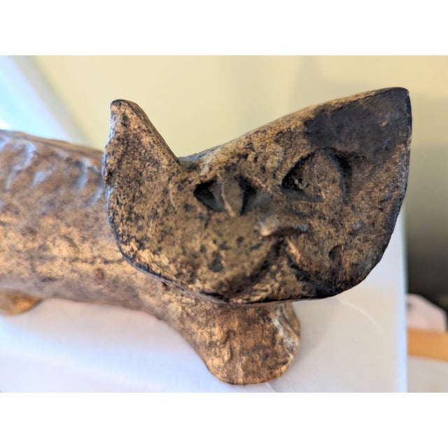 Modern Brass Cat with abstract face. He is very heavy and is lead with brass plated accent The body is textured giving a...