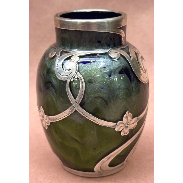 Here we have a super Loetz Titania ( visit Loetz.com for examples ) vase , a flowing green with Lunt Sterling overlay ,...