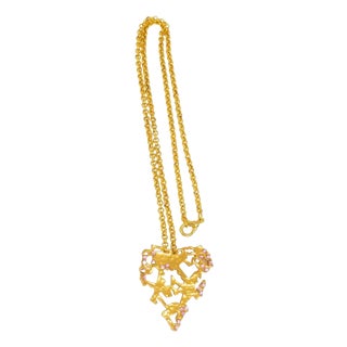 Christian Lacroix Gilt Metal and Pink Jeweled Brutalist Heart Pendant Necklace For Sale