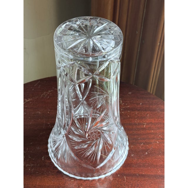 Mid-20th century Bohemian cut crystal vase, produced in Czechoslovakia. Clear lead crystal body with hand-cut pinwheel and...