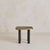 A sculptural 1990s French side table defined by bold material contrast and graphic rhythm. The clover-shaped top is...