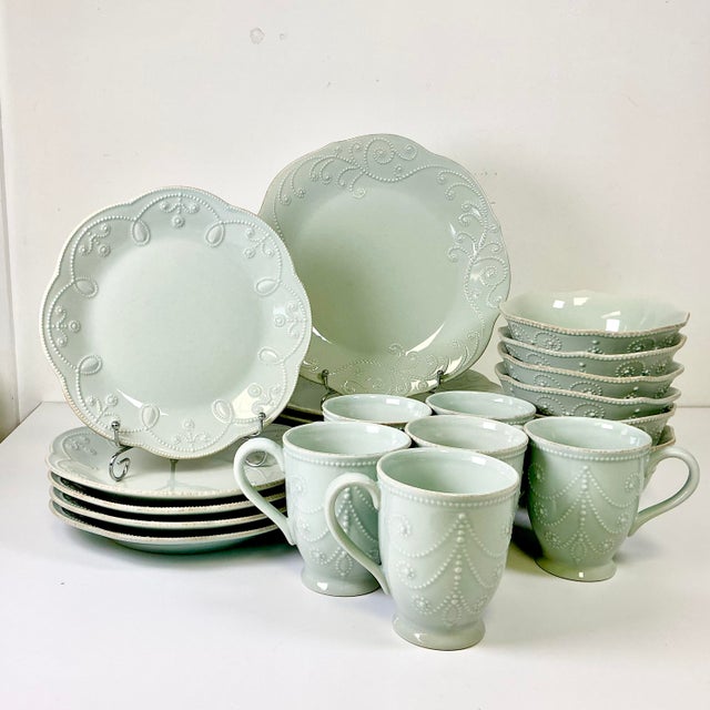 This set of Lenox ironstone dinnerware is lovely. The pattern is French Perle in their Ice Blue color but we believe it’s...