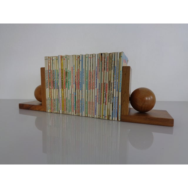 Two wooden bookends from the 1950s.