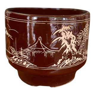 Mid-Century Asian-Inspired Brown Glazed Ceramic Planter With Hand-Carved Landscape Design For Sale
