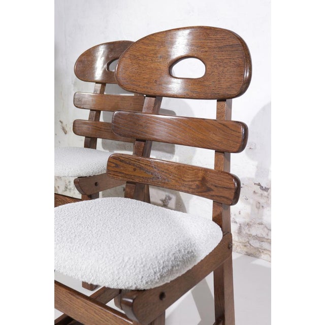 These chairs have a distinct design that appears to be inspired by the organic forms of fish bones, which is an innovative...