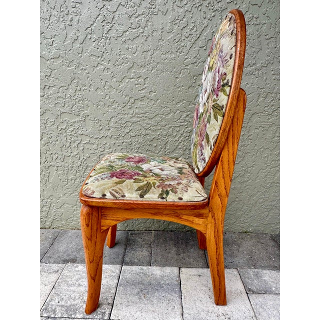 Hand made solid oak vanity chair. Seat and back are cushioned and covered in a floral tapestry with nail head trim. It has...