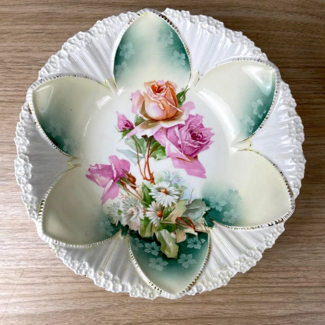 Highly decorative berry bowl and 4 matching individual bowls with applied peach and pink roses with daisies. Raised mold...