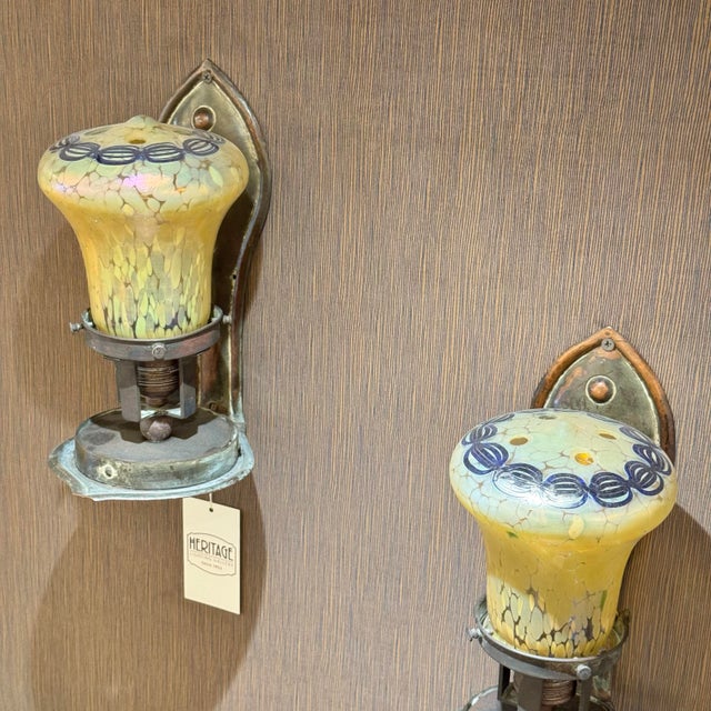 Great pair of artfully designed sconces with expertly detailed glass shades attributed to Loetz. Max Height 10.5” Max...