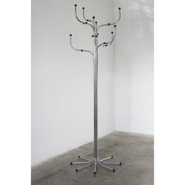 Coat Tree hanger consisting of eight arms of bent steel ending in synthetic balls. The design dates back to 1971. Coat...