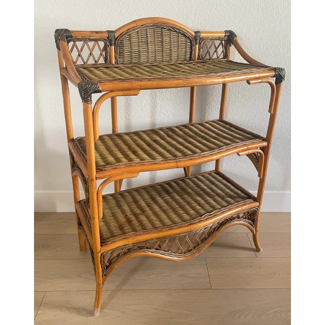Boho at its finest, 3-tiered bamboo and rattan etagere with curved, bent bamboo and rattan. Measures 30" W x 15" D x 40"H...