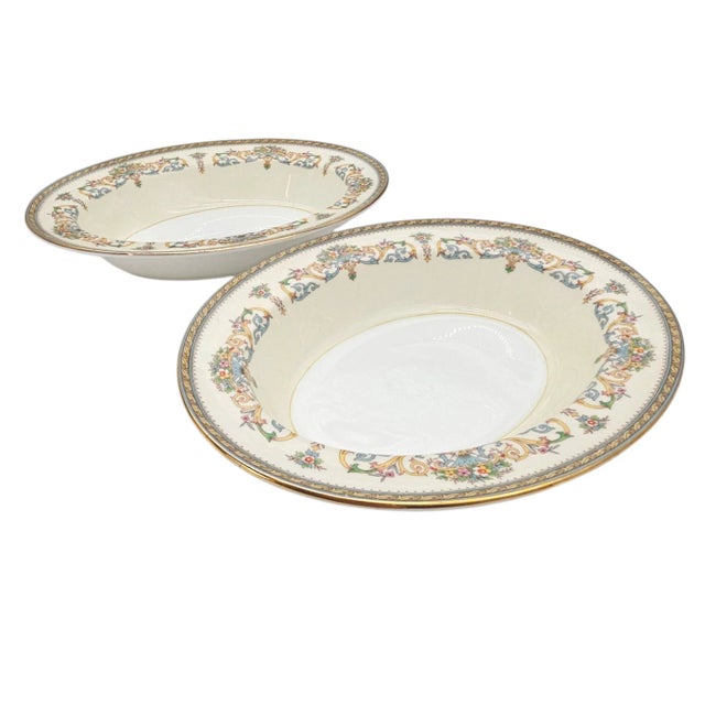 There it sat—oval, immaculate, and utterly English. The rim, an embroidered song of floral scrolls in ochre and celadon,...