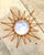 This exquisite vintage Italian sunburst mirror is a masterclass in organic modernism and artisanal craftsmanship....