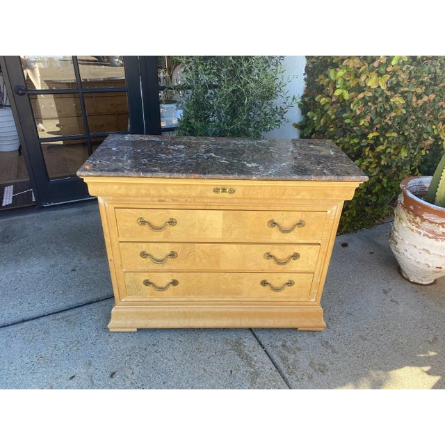 Stunning burl chest with four drawers. One thin drawer on top with three deeper below. All original hardware and...