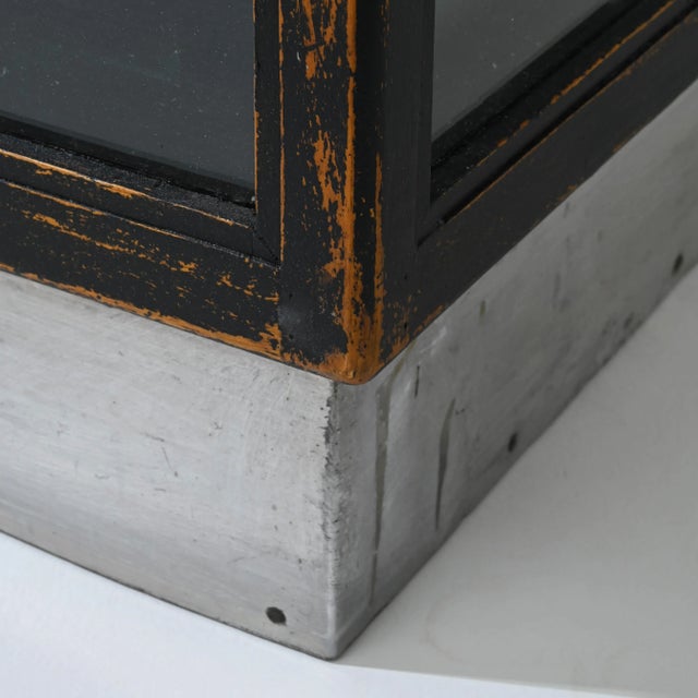 A pair of wooden vitrines created in 20th century France. Understated and minimal, yet still full of character, these...