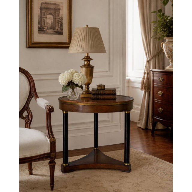 Elegant and timeless, this vintage French Empire style side table by Old Colony Furniture showcases a beautifully figured...