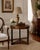 Elegant and timeless, this vintage French Empire style side table by Old Colony Furniture showcases a beautifully figured...