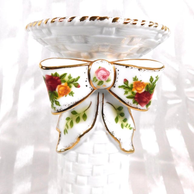 This is a single Royal Albert candlestick holder in Old Country Roses. It has a sticker on the bottom from an unknown...