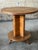 A striking French Art Deco period accent table with a checkered parquetry top. A bentwood pedestal supports the round...