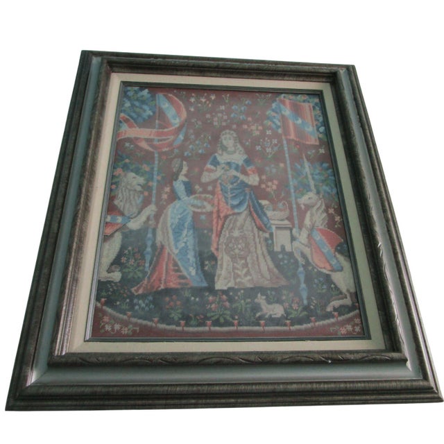 This framed needlepoint artwork, features a medieval-style motif titled "Cluny's L'Odorat." Depicting "A Mon Seul Désir"...