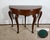 Beautiful half-moon console table in solid veneer and mahogany transformable into a game table. This table has a three...