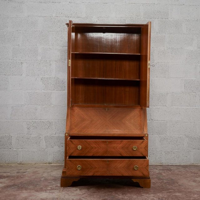 This Art Deco-style drop-leaf trumeau combines the functionality of a storage unit with the linear charm of vintage...