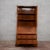 This Art Deco-style drop-leaf trumeau combines the functionality of a storage unit with the linear charm of vintage...