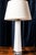 An elegant Swedish table lamp crafted from hand-blown glass by Orrefors, featuring a clear glass body encasing an intense...