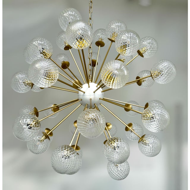 Italian sputnik chandelier with 40 clear Murano glass globes carefully hand blown with bubbles inside the glass using...